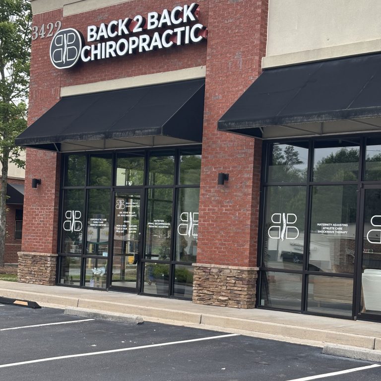 Family receiving personalized chiropractic care near Sixes Road in Canton, Georgia